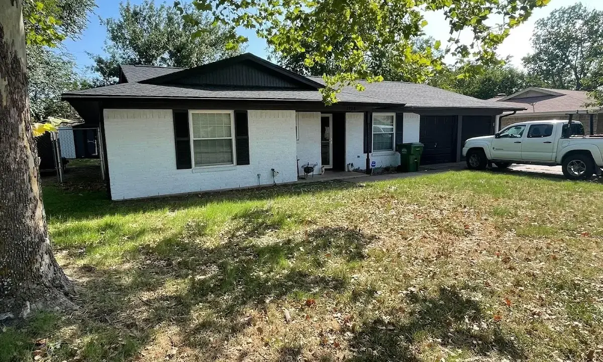 Professional roofing crew working on a residential roof in Cresaptown